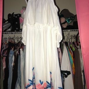 White dress and flower design at the bottom